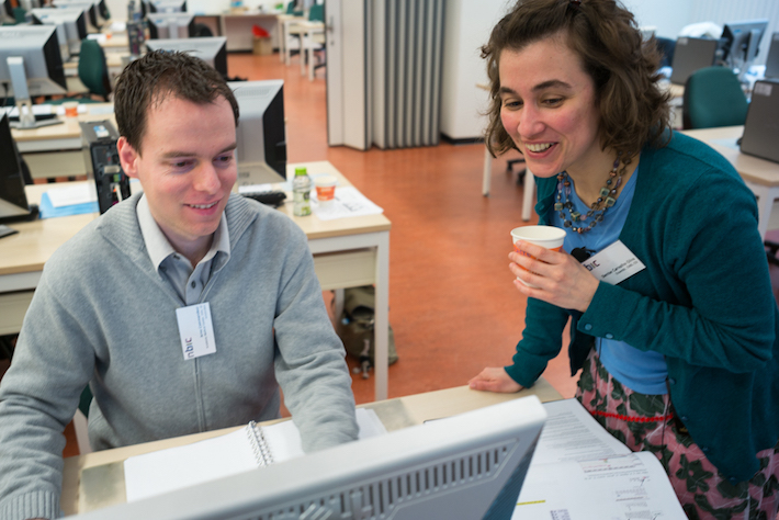 Helping  out a user during a workshop coffee break in the Netherlands